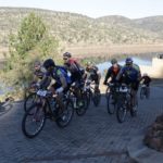 A group of riders labouring up a paved climb during stage three of the Waterberg MTB Encounter. Photo: Gerrie Kriel / Twin Productions SA