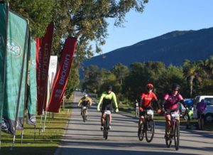 Riders full of smiles approaching the race village at the Storms River Traverse. Photo: ZCMC