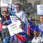 Children showing their support for the riders during the Karoo to Coast. Photo: oakpics.com