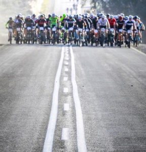 A bunch of riders taking on a tarred road during the Karoo to Coast. Photo: oakpics.com