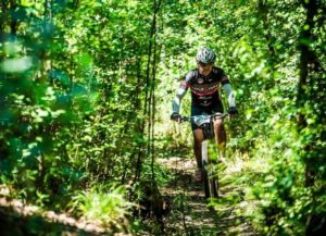 A rider moving through a dense forest section in stage two of the Berg and Bush 'Descent'. Photo: Tobias Ginsberg
