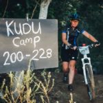 A rider pushing her bike out of Kudu Camp during stage three of the Berg and Bush 'Great Trek'. Photo: Em Gatland