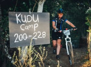 A rider pushing her bike out of Kudu Camp during stage three of the Berg and Bush 'Great Trek'. Photo: Em Gatland