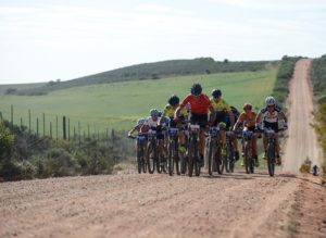 A bunch of riders moving on a gravel road during stage one of the Cape Pioneer Trek. Photo: Marike Cronje