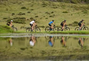 Riders moving alongside a river during stage two of the Cape Pioneer Trek. Photo: Carli Smith