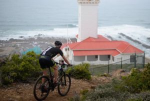 A rider spoiled with a great view of the ocean and a lighthouse during the prologue of the Cape Pioneer Trek. Photo: Zoon Cronje