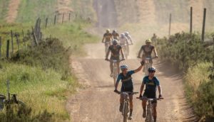 Riders greeting the cameraman on stage two of the Wines2Whales