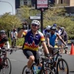 A rider waving to supporters during the 947 Cycle Challenge. Photo: 947 Cycle Challenge