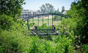 Riders cross a bridge during the 947 MTB Challenge