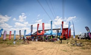 Riders fuelling up at a waterpoint along the route at the 947 MTB Challenge