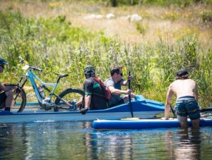 Riders taking it easy in a raft during the Origin of Trails. Photo: David Tarpey