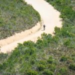 A wonderful aerial shot of riders moving along a wide and open gravel section at the Origin of Trails. Photo: David Tarpey
