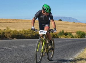 A rider looking at his surrounding while moving along a tarred road during stage two of the Sanlam MTB Invitational today. Photo: Henk Neuhoff Photography