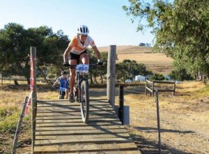 A rider navigating her way over a bridge during stage two of the Sanlam MTB Invitational today. Photo: Henk Neuhoff Photography