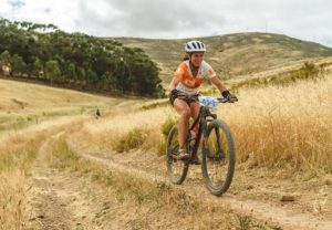 A rider moving through a grassy jeep track section during stage two of the Sanlam MTB Invitational today. Photo: Henk Neuhoff Photography