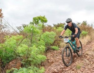 A rider moving down a rocky descent during the sixth Trailseeker Series event. Photo: Facebook/Nissan Trailseeker