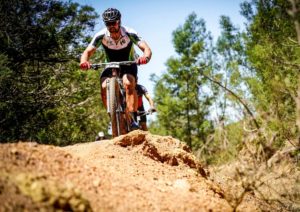 A rider about to drop down a descent during the TransCape MTB Encounter. Photo: Jacques Marais