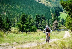 A rider moving on a track below the mountains, which makes a spectacular background shot. Photo: Jacques Marais