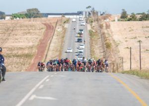 A bunch of riders moving along an undulating road during the second stage of the Tour of Good Hope. Photo: Henk Neuhoff Photography