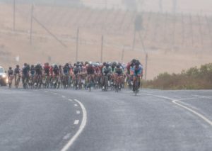 A far shot of the bunch moving around a bend during stage one of the Tour of Good Hope. Photo: Henk Neuhoff Photography