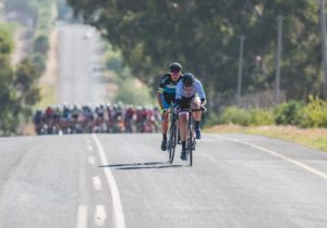 A breakaway of two riders labouring on while the bunch gives chase during stage two of the Tour of Good Hope. Photo: Henk Neuhoff Photography